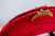  SUNEV COUTURE - HOT RED STRAW HANDWOVEN CANOEMANYE CLUTCH WITH MULTI- COLOUR EDGE AND MOON BRASS CLASP